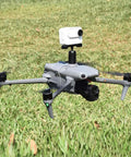 Drone with Expansion Bracket With One Quarter Inch Screw Adapter for camera mount, flying over grass field