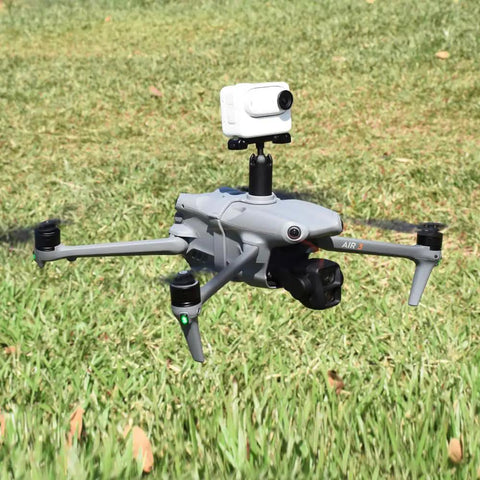 Drone with Expansion Bracket With One Quarter Inch Screw Adapter for camera mount, flying over grass field