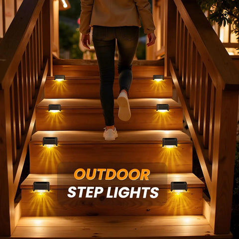 16 Pack Solar Deck Lights Outdoor Waterproof LED Fence Lamps lighting wooden stairs at night with warm white glow