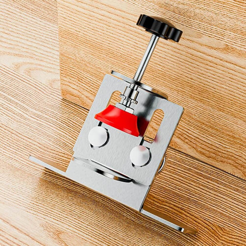 Close-up of Effortless Cabinet Door Installation Tool Kit with adjustable clamp and positioner on wooden surface