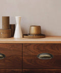 Wooden dresser with 8 Pack 3.5 Inch Center Vintage Farmhouse Cup Pull Handles in Flat Bronze, decor items on top