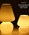 Tall Mushroom Glass Table Lamp With Romantic 12 Inch Vintage Swirl Mid Century Design next to smaller lamp glowing softly