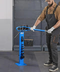 VEVOR Manual Pipe Bender With 14 Dies in use, bending copper pipe on heavy-duty blue stand, ideal for HVAC repairs.