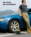 Cordless 160 PSI Tire Inflator Portable Air Pump With Digital Gauge And LED Light used on blue car in outdoor setting