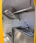 Road Ready Mobile Food Truck Trailer With Dope Commercial Kitchen Setup, stainless steel sink shown inside kitchen space.