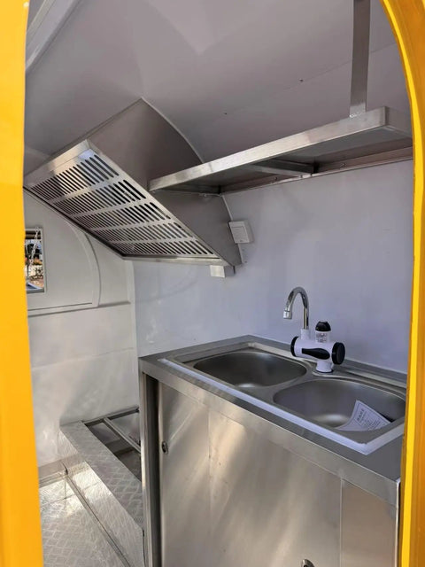 Road Ready Mobile Food Truck Trailer With Dope Commercial Kitchen Setup, stainless steel sink shown inside kitchen space.