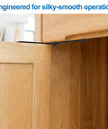 Four Pack Concealed Pivot Door Hinges Delivering 360 Degree Rotation And Bulletproof Stainless Steel Build installed in a wooden cabinet.