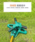 360 Degree Rotating Garden Sprinkler For Yard And Lawn on green grass, showing hose hookup and adjustable arms for irrigation