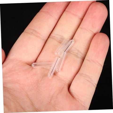 Clear Plastic End Caps 100 Pack for Screws and Round Tubing shown in hand close-up