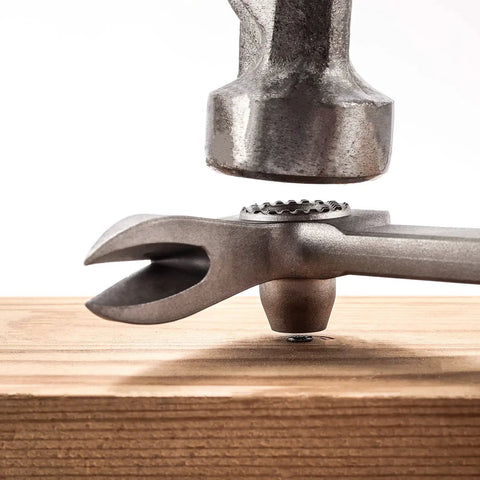 12 Inch Titanium Nail Puller Dual Ended Cats Paw Pry Bar Crowbar in use for quick nail extraction on wood surface