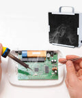 Soldering Smoke Absorber With Carbon Filter Fume Extractor Fan for DIY desoldering station capturing toxic fumes near workspace.