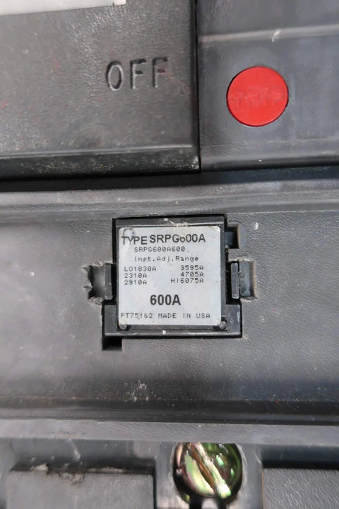Close-up of Pro Grade Heavy Duty Three Pole Six Hundred Amp Circuit Breaker showing the specifications label and OFF switch.