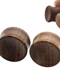 Close-up of Organic Wood Ear Gauges Set, 6 Pieces, Double Flared Saddle Plugs Stretcher, Three Quarter Inch 20mm, Brown Teak Finish.