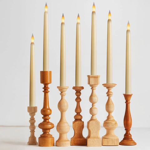 12 Pack Ivory Flameless LED Taper Candles, 11 Inch Tall, Battery Operated With Bottom On Off Button in wooden holders