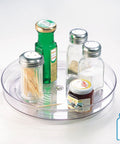 Clear 9-Inch Lazy Susan Organizer with condiments, perfect for cabinets and pantries, showcasing easy reach and organized shelves.