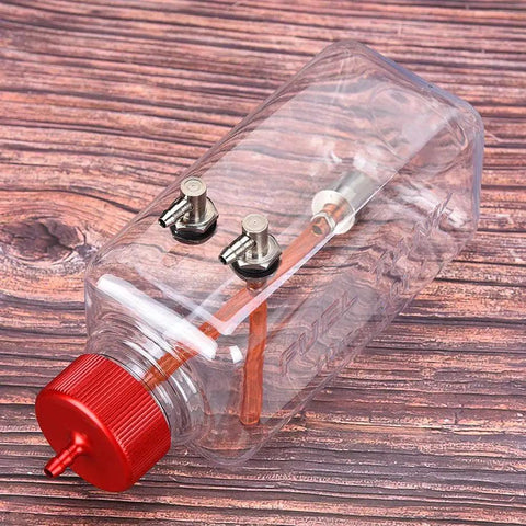 RC Fuel Tank For Airplanes 300ml transparent plastic with CNC machined metal cap, leak proof on wooden surface view