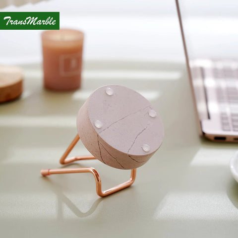 Marble Phone Stand With Metal Holder Charges While You Use It, Swipe Up To Unlock, Natural Marble Base, Dual Function Phone Stand And Business Card Holder For Office Desk, Rose Pink And Rose Gold on a desk with laptop.