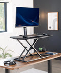 Budget Friendly 29 Inch Height Adjustable Standing Desk Converter for Sit Stand Workstation with monitor and keyboard setup