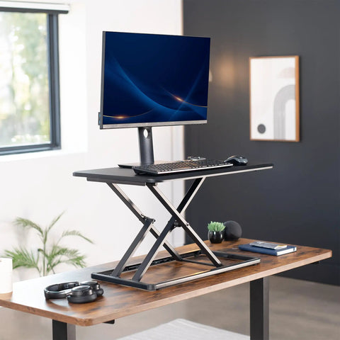 Budget Friendly 29 Inch Height Adjustable Standing Desk Converter for Sit Stand Workstation with monitor and keyboard setup