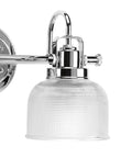 Close-up of a Two Light Coastal Bath Vanity Light with Clear Double Prismatic Glass Shade in Polished Chrome Finish for bathrooms