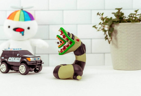 Beetlejuice Sandworm LED Mood Light on white surface with toys and plant, stands about 4.75 inches tall