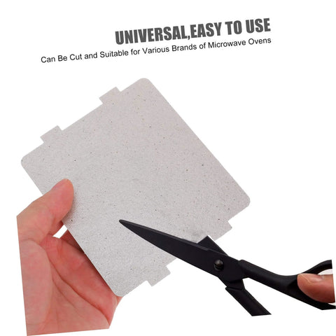 Person cutting Microwave Oven Mica Sheets 10 Pieces Heat Resistant Mica Flakes Replacement Kit with scissors.