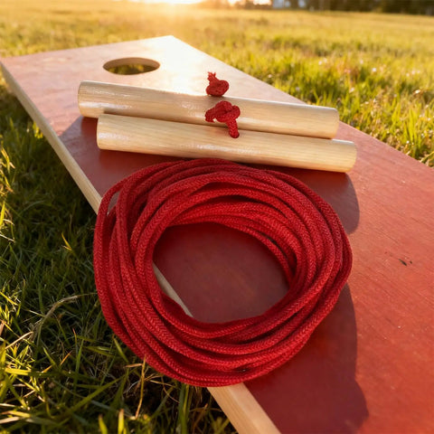Cornhole Measuring Device 27ft With Silicone Tie And Bag For Regulation Ready Distance Setup And Fast And Accurate Board Alignment Lightweight Varnished Sticks And Low Stretch Rope For Pro Level Games, two varnished sticks with red rope on board