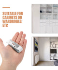 12 Piece Sliding Cabinet Door Rollers With Silent Nylon Wheels And Heavy Duty Steel Design For Rolls Like Butter held in hand with wardrobe background.