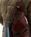 Built Tough Swivel Bolt Snap Hooks With D Ring Ends Rock Solid Lobster Claw Trigger Clips For Handbags Purses Knitting And Leatherwork Matte Black Pack Of 10 attached to a brown leather bag.