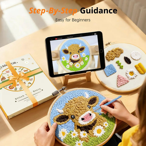 No Fuss Easy Starter Punch Needle Kit for Adults With Highland Cow Design in use, showing embroidery hoop with cow art and tablet tutorial.