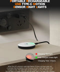 Rechargeable Magnetic Puck Lights With Motion Sensor charging via USB-C, showing red light for charging status and green for full charge.