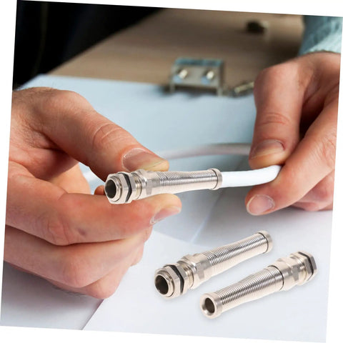Hands holding Brass Cable Glands Kit 4 Pack With 2 Way Glands And Metal Connectors for secure wiring in electrical applications
