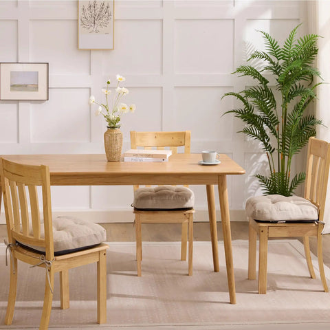 Memory Foam Dining Chair Cushions Set of 4, tufted indoor chair pads with non slip ties, ultra comfy, beige, on wooden chairs.