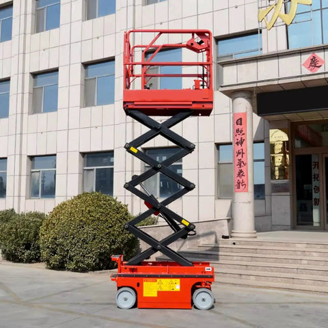 Heavy Duty Scissor Lift Platform For Smooth Station Connection And Quick Material Height Adjustment Transform Your Workshop Workflow While Safely Moving Big Loads With Zero Sweat Now, red scissor lift shown up high near building.