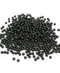 Raised Panel Cabinet Door Spacers 500 Pack Quarter Inch Black Rubber Ball Bumpers scattered on a surface for installation stability.
