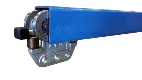 Close-up of Unibilt Blue Enclosed Track System Overhead Trolley Conveyor for farm and industrial use with steel support.