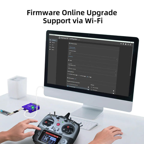 2.4GHz ER16 ELRS FPV 16CH Receiver setup with RC transmitter on desk near monitor showing firmware upgrade