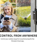Woman using phone to control Outdoor Matter Smart Plug 2 Pack IP65 Waterproof, sprinkler operating in the background.