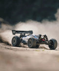 ARRMA Typhon 1 Eight Scale RC Buggy Ready To Race 6S 4WD BLX RTR racing on dirt with TLR Tuned parts and race spec red blue body