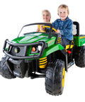Kids riding a green John Deere Gator XUV ride-on toy, compatible with 12V Gearbox Replacement Kit White For John Deere Gator XUV And Polaris RZR 900.