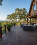 Durable As Nails Reactive Water Based Wood Stain Lays Down A Knockout Warm Brown Finish For Barn Siding Ranch Beams And Deck Projects VOC Free Low Odor Heavy Duty Plus on rustic outdoor patio with mountain view.
