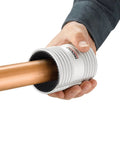 Ridgid 29993 227S chrome stainless pipe reamer tool, side view around copper pipe held in hand