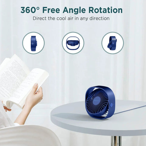 Go To Ultra Quiet USB Desk Fan With 360 Degree Rotatable Head 3 Speeds Ultra Portable Table Fan in blue on desk next to reader