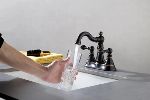 Oil Rubbed Bronze Two Handle Bathroom Sink Faucet for 3-Hole 4-Inch Center Set with Pop-Up Drain, 360 Degree Swivel Spout, Lead-Free Waterway, Easy DIY Install, EW-516-NB in use filling a glass with water