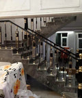 Knockout Square Deck Balusters And Stair Spindle Kit Brings Eight Top Shelf Posts with gold and black design on indoor staircase.