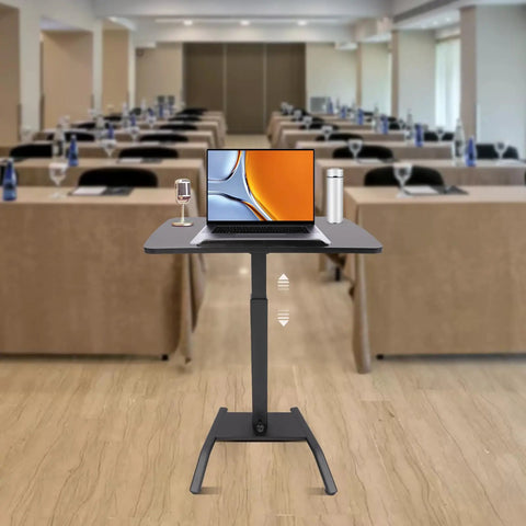 Premium Adjustable Height Standing Desk With Smooth Foot Pedal Operation And Fully Rolling Ergonomic Office Station in conference setting.