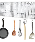 Image showing Badass Double Pegboard Hooks 15 Piece Set Crafted From Hella Tough Steel holding kitchen tools on a pegboard.