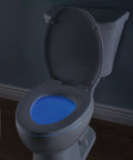 Elongated Nightlight Toilet Seat With Soft Close And Quick Release, Battery Powered Night Light glowing blue in bathroom.