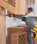 Pivoting Impact Driver Bit Tip Holder With Ring, One Quarter Inch Shank Fits Any Chuck Or Impact Driver, Delivers Up To Two Thousand Inch Pounds Of Torque For Tightening Loosening And Drilling, Durable Steel Construction in use on a wooden cabinet