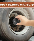 Heavy Duty Four Piece Trailer Wheel Bearing Protectors With Chromed Metal Dust Caps Built Solid Road Warrior Cover For Boats And Trailers Rubber Gasket Seal One Point Nine Eight Inch Axles being installed on trailer wheel.